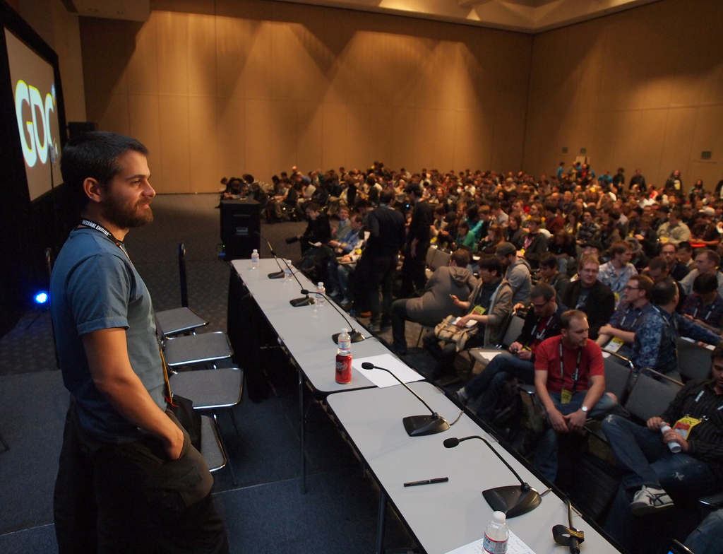 A packed room at the Experimental Gameplay Workshop at GDC 2011, seen from the stage