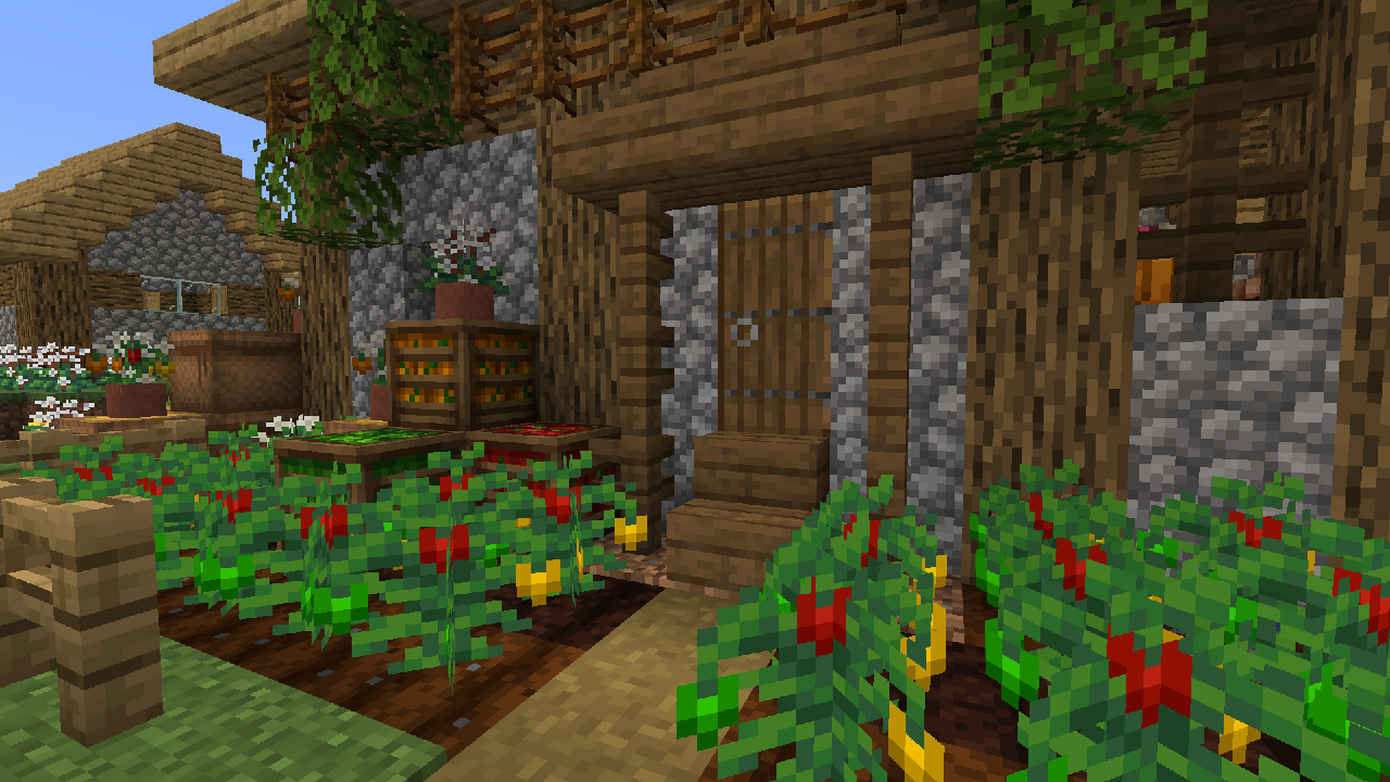Harvested crop rows next to a farmhouse