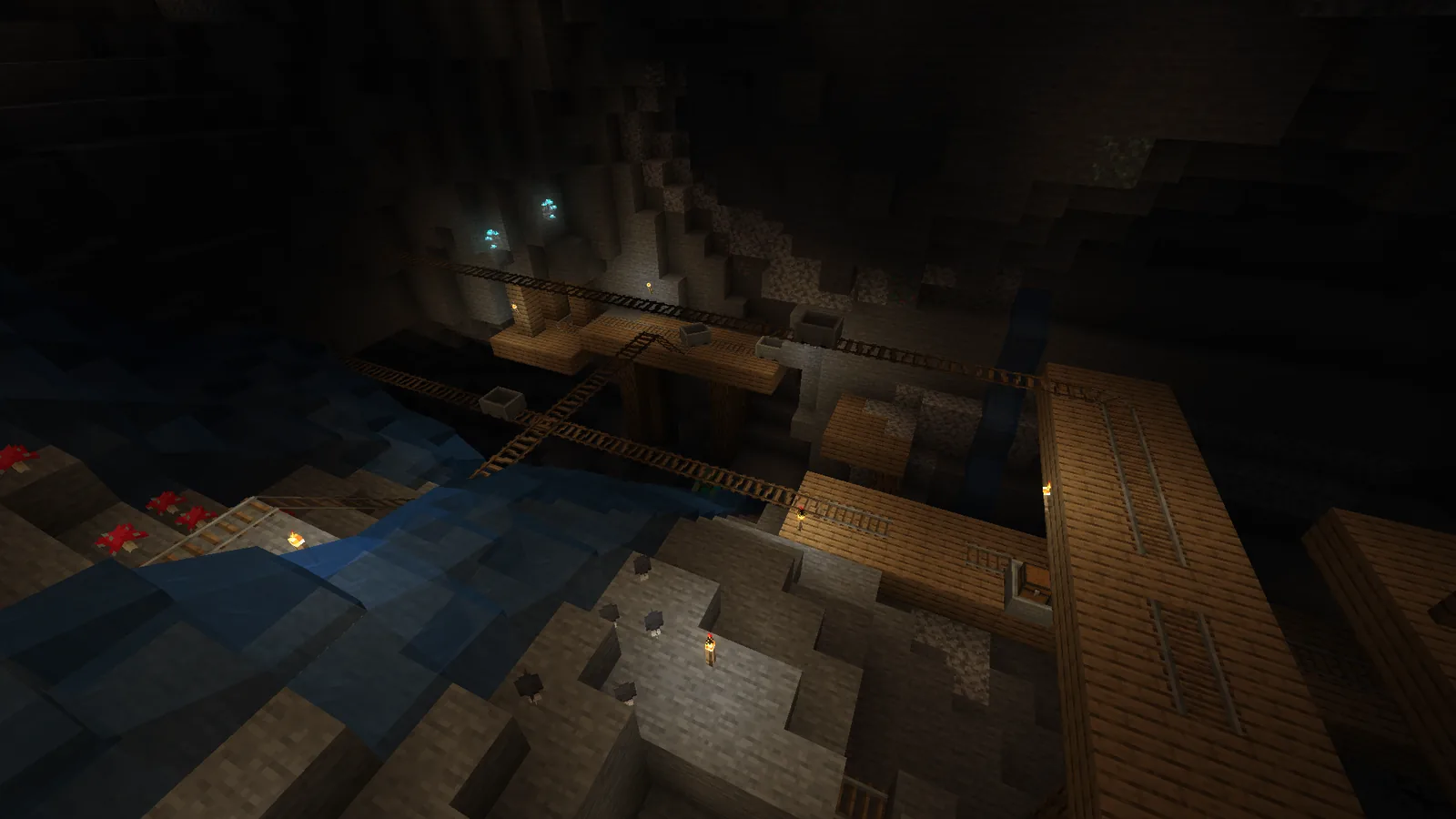A dark Minecraft cavern lit by torches
