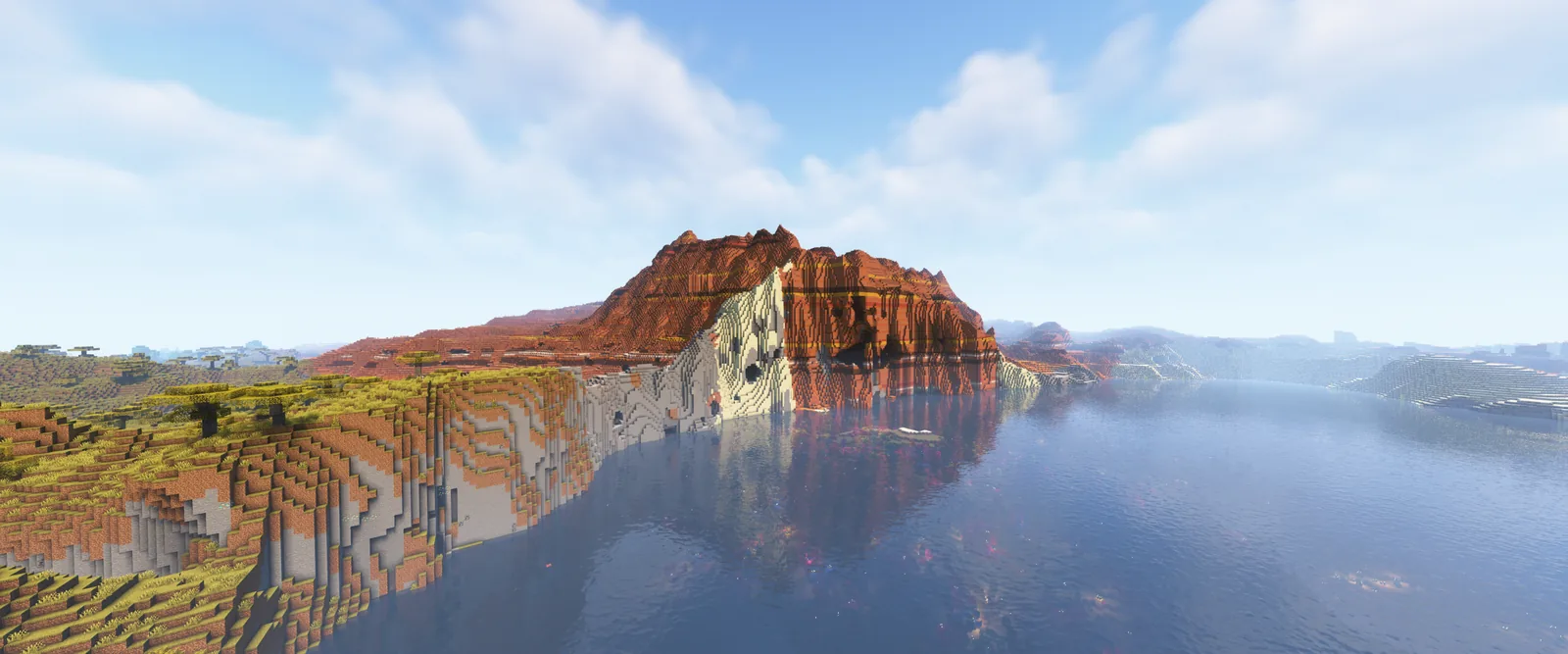 Wide Minecraft mountain landscape rendered with Complementary Shaders through Iris