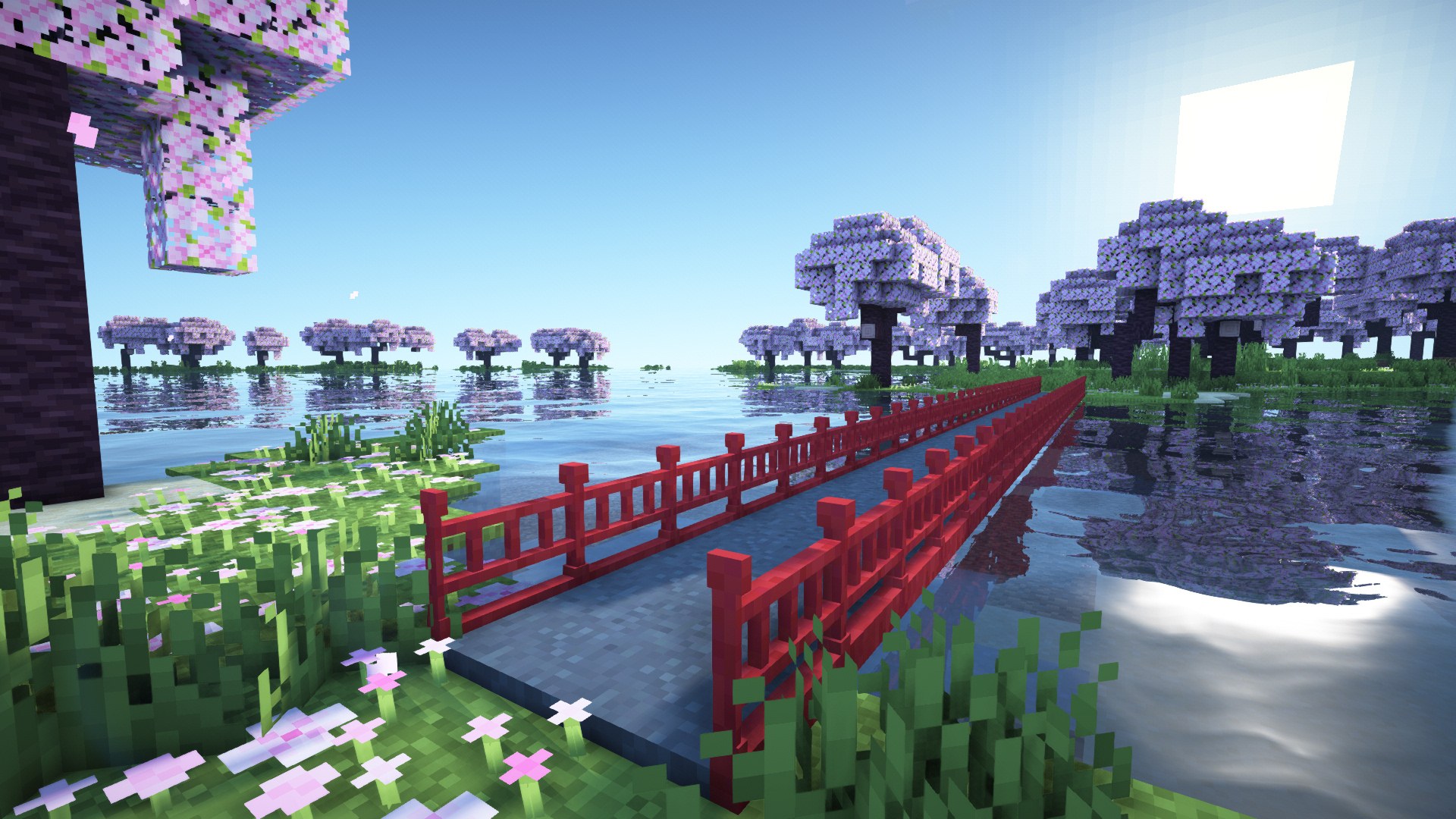Red lacquered arched bridges over a garden pond