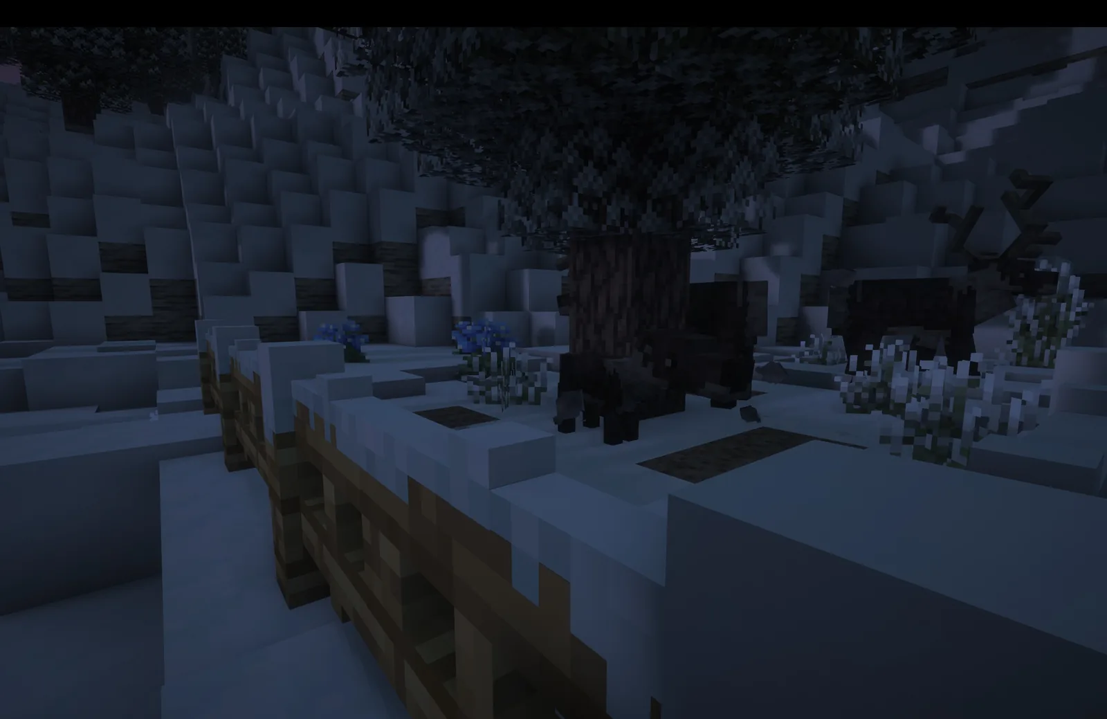 Alpine Minecraft terrain with layered snow