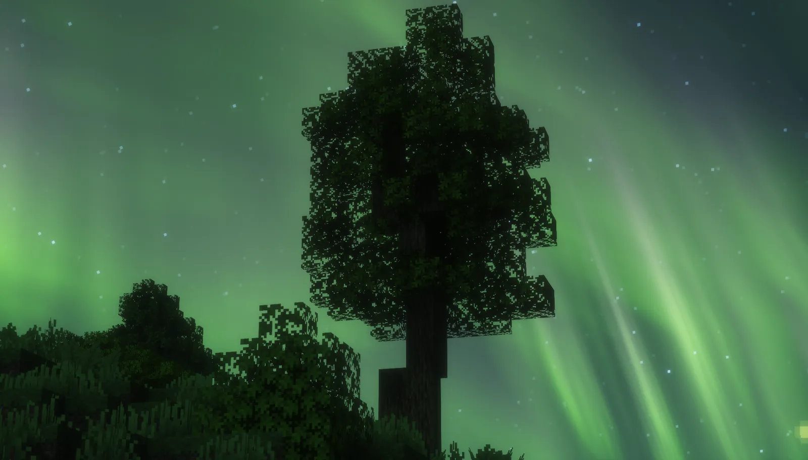 Player flying with an elytra over Minecraft terrain