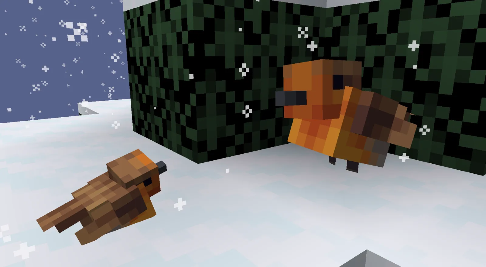 Snow covered Minecraft landscape under a clear sky